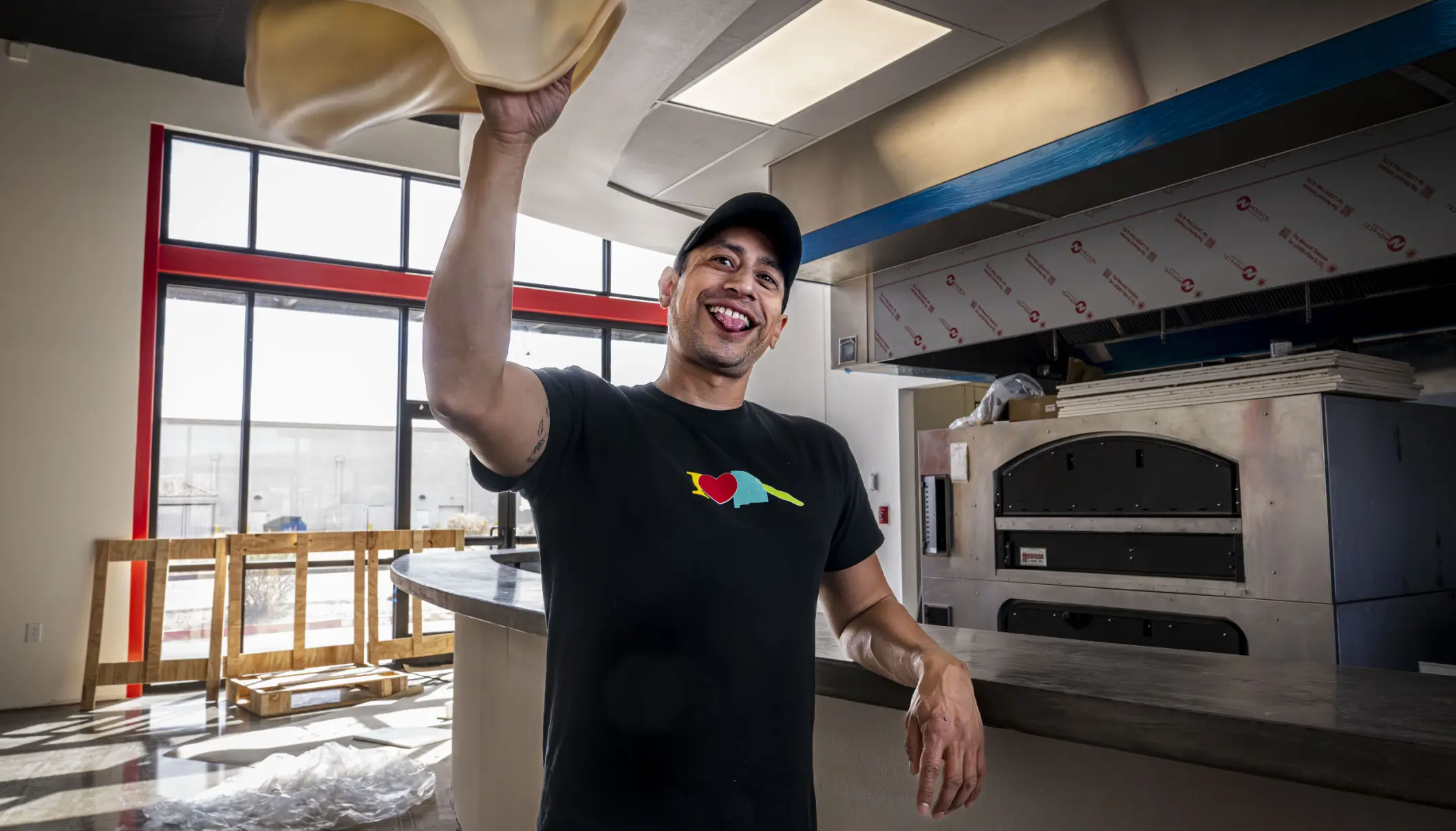 Chuck tossing pizza
